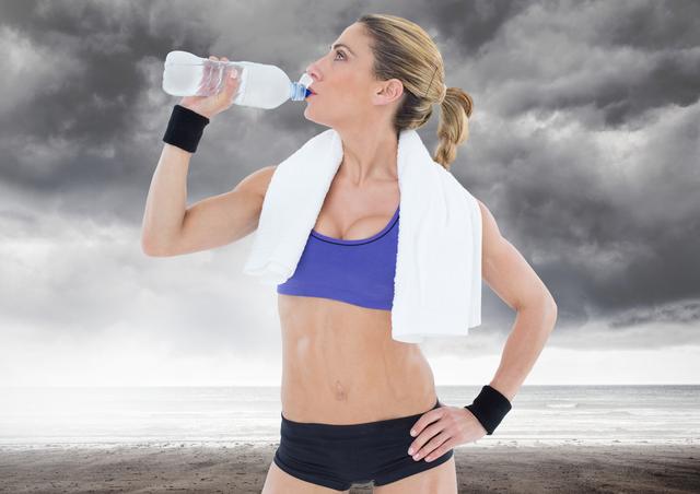 Digital composition of healthy woman drinking water against stormy sky in background