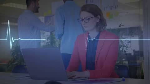 Businesswoman Analyzing Data Overlaid with Heartbeat Graph