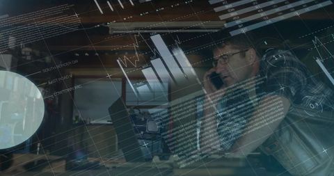 Analyst Monitoring Data While on Smartphone in Modern Office Environment