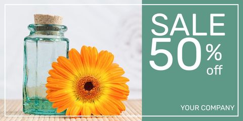Spring sale banner with orange gerbera and glass bottle