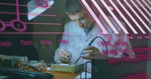 Engineer Soldering with Digital Data Overlay