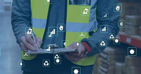 Warehouse inspector checking clipboard with ar icons for logistics safety sustainability