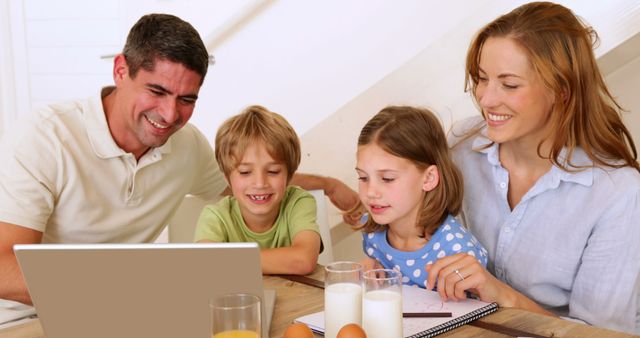 Happy Family Learning Together at Home Around Laptop - Download Free Stock Images Pikwizard.com