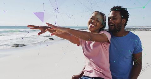 Joyful Couple Relaxing on Beach With Digital Overlay