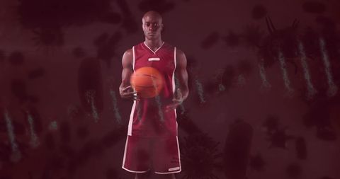 Basketball player dribbling amidst futuristic cell illustrations