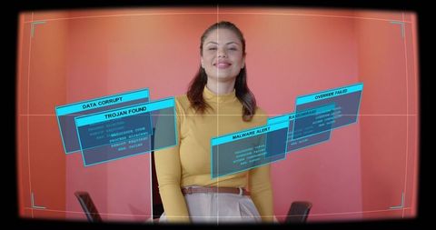 Presenter showing futuristic holographic cybersecurity interface with camera focus overlay