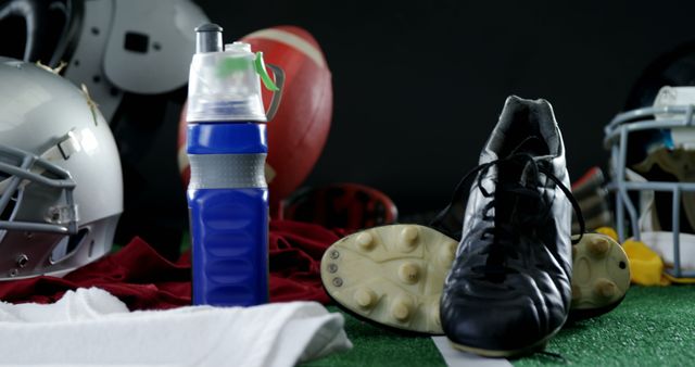 Various sports equipment on artificial turf against black background 4k
