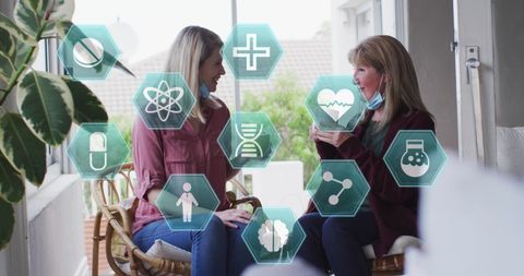 Women Enjoying Coffee with Digital Health Symbols Overlay