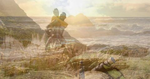 Hiking couple embracing adventure on coastal trail at sunset