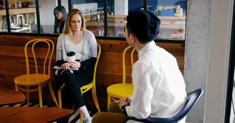 Diverse Colleagues Having Casual Meeting in Cafe Setting
