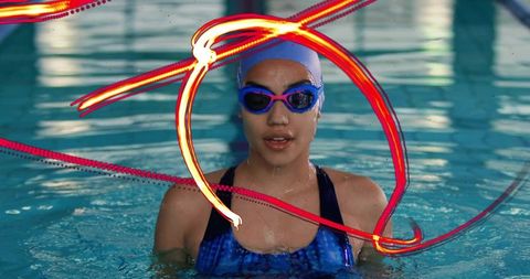 Focused Swimmer in Pool with Goggles and Swim Cap