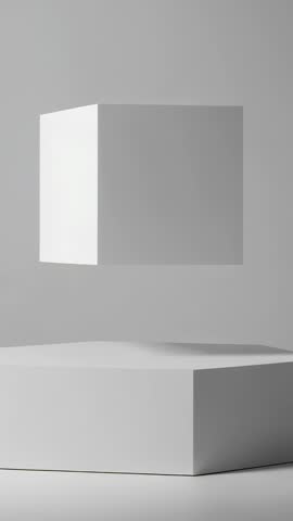 Vertical video rotating white cube hovering above hexagonal pedestal in minimal studio