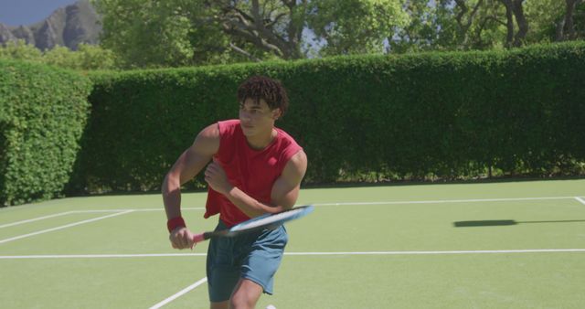 Focused Young Athlete Playing Tennis on Outdoor Court - Download Free Stock Images Pikwizard.com