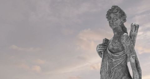 Ancient Stone Sculpture Against Cloudy Sky Background
