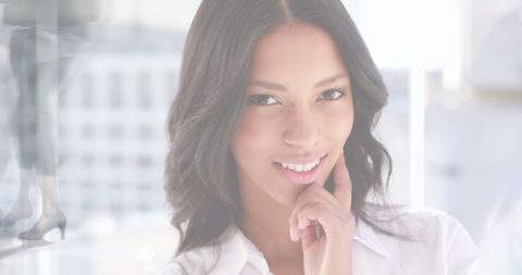 Confident Urban Businesswoman Overlooking Cityscape