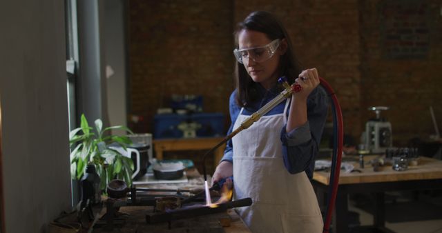 Female Artisan Using Blowtorch in Workshop - Download Free Stock Images Pikwizard.com