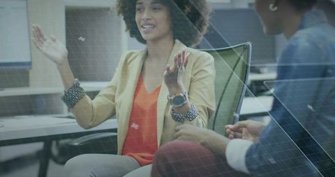 Business professionals engaging in collaborative discussion at office