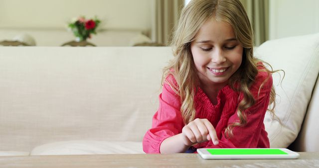 Smiling Girl Using Digital Tablet at Home - Download Free Stock Images Pikwizard.com