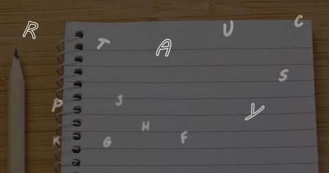 Evolving letters over ruled notebook and pencil