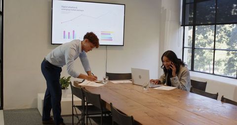Business Colleagues Collaborating in Modern Conference Room
