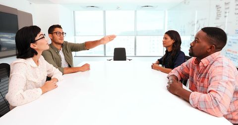 Diverse Team Engaging in Brainstorming Session with Copy Space