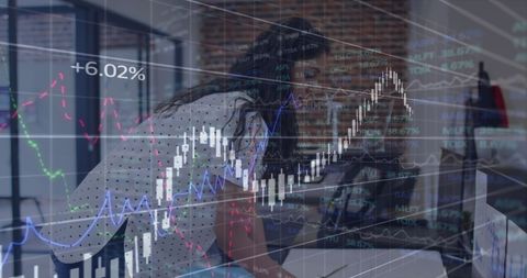 Businesswoman Analyzing Financial Data Overlays
