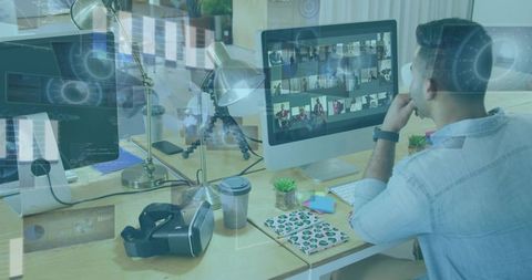 Remote team collaborating at workstation with vr headset and multi-monitor video conference