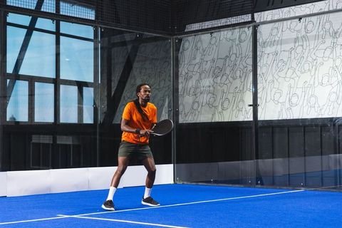 Young Athlete Practicing Padel Tennis on Blue Court