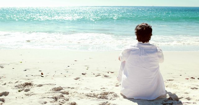 Man Enjoying Relaxing Moment at Sunny Beach - Download Free Stock Images Pikwizard.com