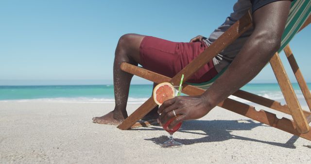 Relaxing on Beach with Fresh Tropical Cocktail in Hand - Download Free Stock Images Pikwizard.com