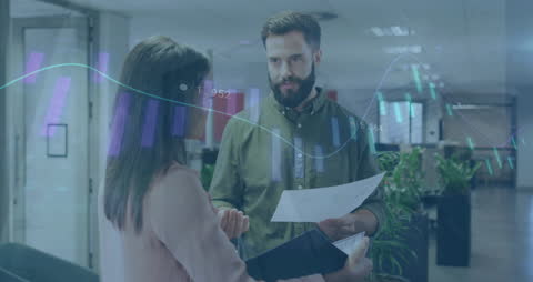 Multiracial Colleagues Discuss Financial Report in Modern Office