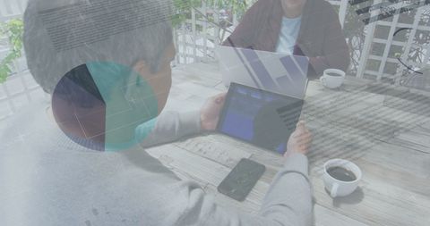 Business Technology Meeting With Digital Tablets and Laptops