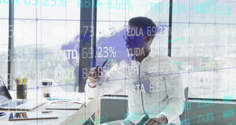 Businessman Analyzing Stock Market Data in Office Environment