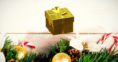 Gold Gift Box with Christmas Decor on Wooden Background - Download Free Stock Images Pikwizard.com