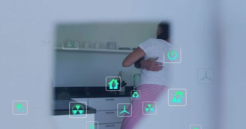 Couple embracing in smart kitchen showing wearable watch and floating iot icons