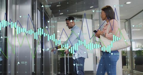 Business Professionals Analyzing Growth with Financial Graphs Overlay