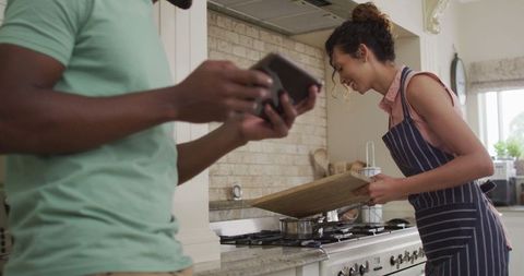 Happy Couple Cooking Together: Kitchen Fun and Connection