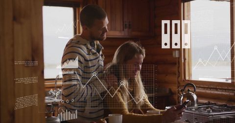 Couple Analyzing Financial Data in Cozy Cabin Kitchen