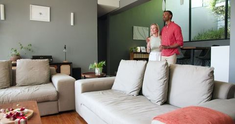 Couple Enjoying Celebration at Home with Champagne
