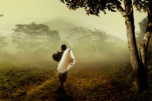 Man Walking on Rural Path with Net During Dawn - Download Free Stock Photos Pikwizard.com