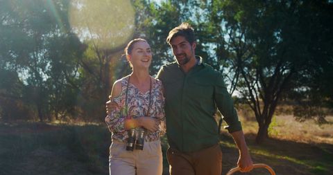 Couple Enjoying Nature Walk in Sunny Outdoors