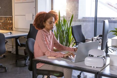 Focused professional woman working with vr and technology