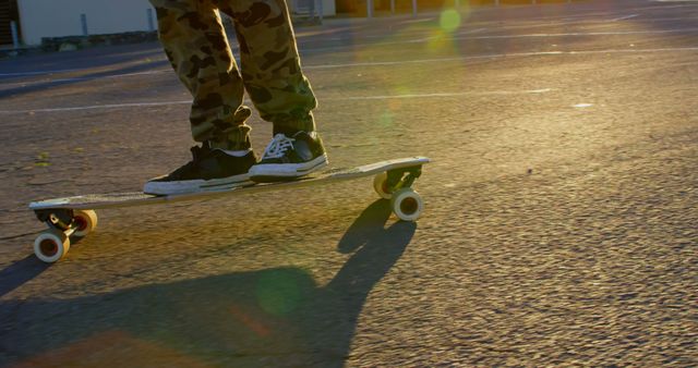 Skateboarder in sunset with camouflage pants - Download Free Stock Images Pikwizard.com