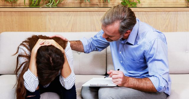 Empathetic Counselor Consoling Distressed Woman During Therapy Session - Download Free Stock Images Pikwizard.com