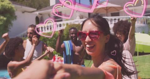 Joyful Gathering by Backyard Pool with Floating Pink Hearts