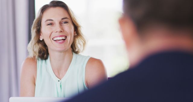 Businesswoman Smiling During Informal Meeting in Office - Download Free Stock Images Pikwizard.com