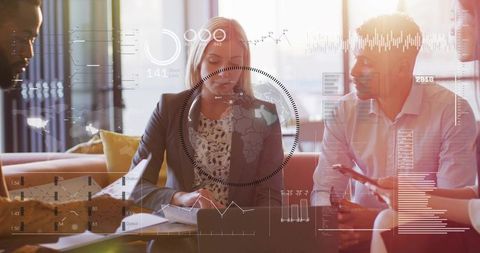 Business team collaborating in modern office lounge with woman leading data-driven meeting