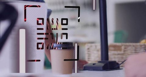 Contactless qr code payment at cafe counter with disposable coffee cup and card terminal