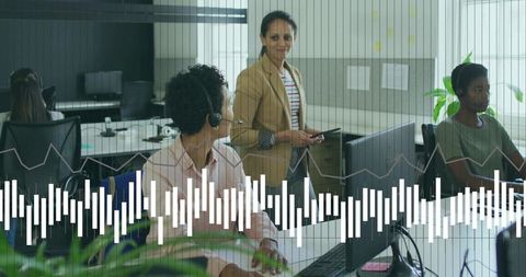 Teamwork in modern office with mid-aged female leader engaging in presentation