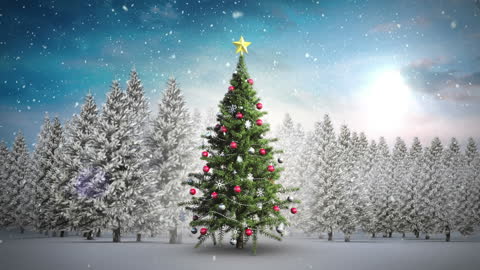 Christmas Tree with Snow Falling Over Scenic Winter Landscape